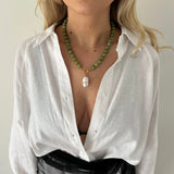 Green jade beaded necklace with gold clasp styled with pearl charm