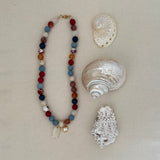 Blue and brown mixed beaded statement necklace with fish charm and round bezel charm