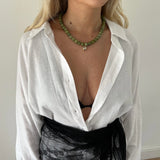 green jade beaded statement necklace with an oval cut bezel pendant styled
