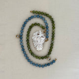 Blue Angelite beaded oval pendant and green jade beaded oval pendant necklaces